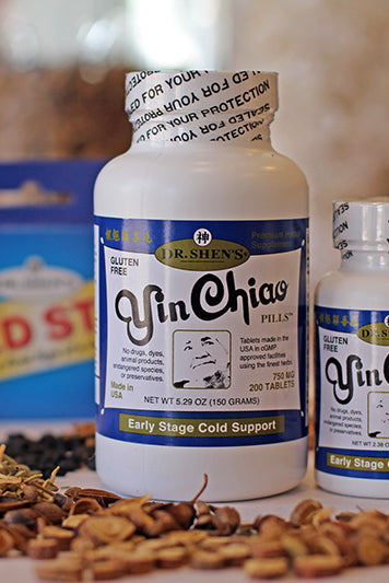Yin Chiao pill bottles large and small, and a package of Cold Stop